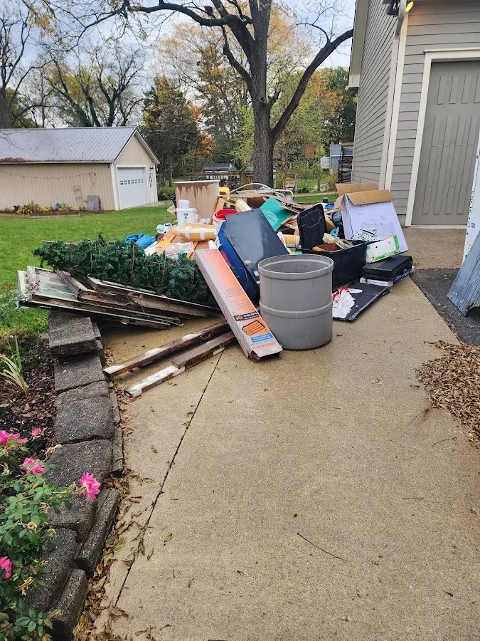 Dumpster being loaded with debris for Roofing Dumpster Rental in Gonzales